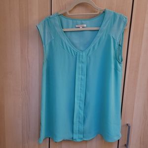 Teal sleeveless blouse